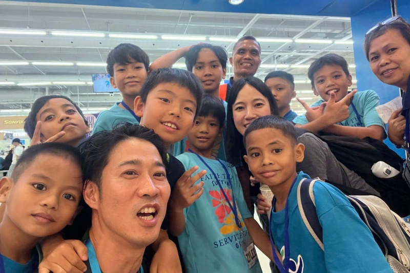 Reeracoen, +one and CMSP participants with children during the 2026 +one visit to CMSP Children’s Village in the Philippines.