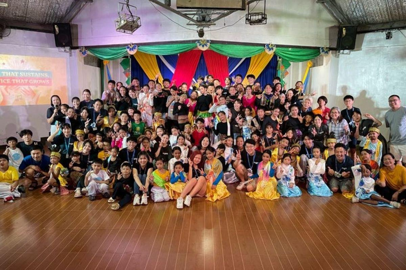 Reeracoen, +one and CMSP participants with children during the 2026 +one visit to CMSP Children’s Village in the Philippines.