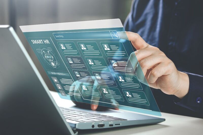 An AI job interview on a laptop with analytics on screen.